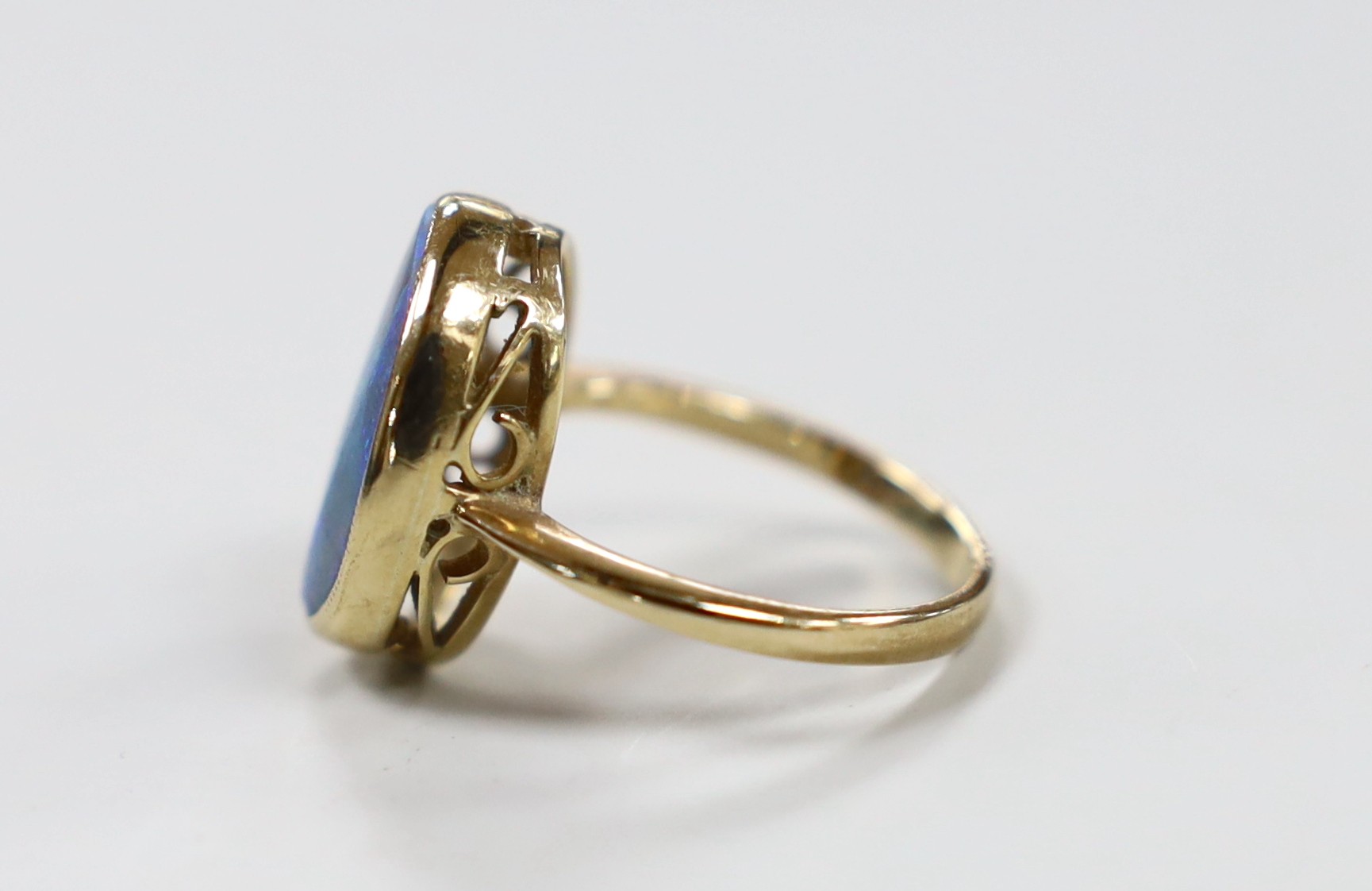 A 9ct and oval black opal set ring, size O, gross weight 4.3 grams.